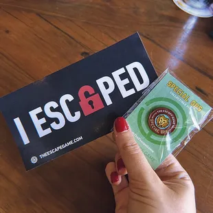 We escaped the Special OPs room! Got a pin to celebrate