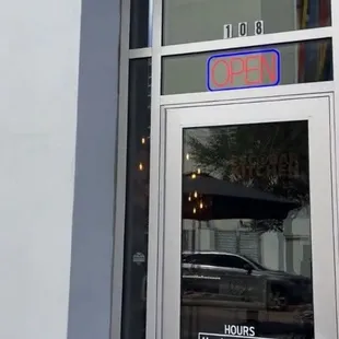 Storefront at Unit 108. Shared with Wine &amp; Corks.