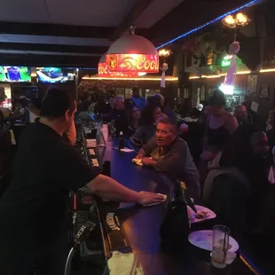 people sitting at the bar