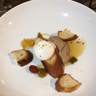Foie gras with jalapeño honey, house baked croutons, farm raised, fresh poached egg and spiced tomatoes.
