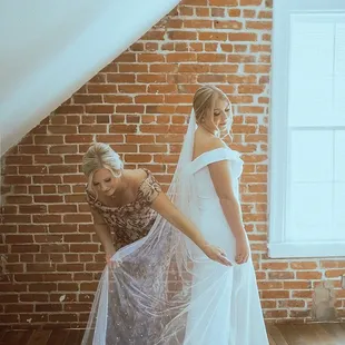 Mama of Bride getting her daughter ready upstairs.   @amandaandnico Www.AmandaandNico.com Instagram.com/amandaandnico