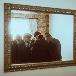 Groomsmen praying over groom before ceremony.   @amandaandnico Www.AmandaandNico.com Instagram.com/amandaandnico