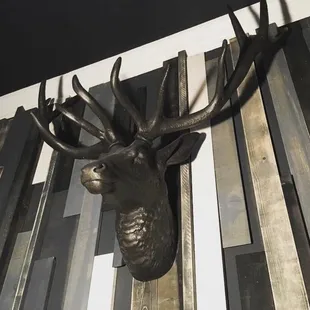 Cool 50 shades of gray textured plank wall + deer at the Estate night club and event venue, downtown St. Pete
