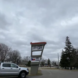 In the parking lot the restaurant sign