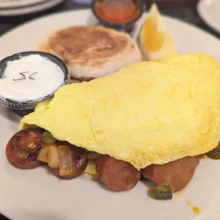Angry Rooster omelette with English muffin.  Comes with a sweet salad and sour cream