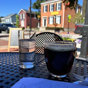 a cup of coffee and a glass of water
