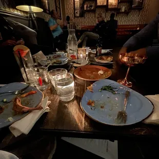 a table full of dirty dishes