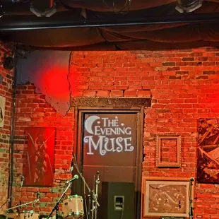 a stage with a brick wall