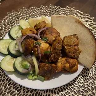 Perfectly done chicken sekuwa with pita bread (comes with a side of rice).