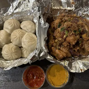 Chicken Momo (left) and Chicken Chili (right); comes w/two sauces -- so spicy and delicious!