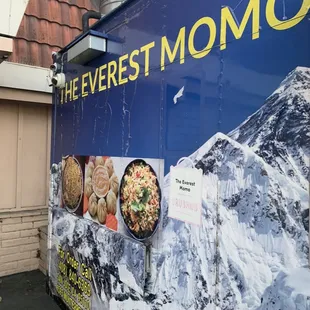 a food truck parked in front of a building