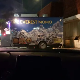 a truck parked in front of a building