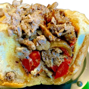 A cross section look at a ribeye dip... the Torta Mojada.  Birria is the dip.  Nearly a half pound of ribeye on a Liedenheimer roll.