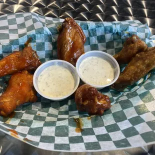 Best wings in Texas, left sauced with Sriracha Honey Butter, cilantro lime EVThing Barbecue, and mango peach habanero.