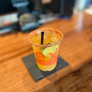 a shot of a drink with a straw