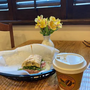 a sandwich and a cup of coffee