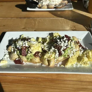 avocado bubble waffle added egg &amp; bacon, across from that is the cinnamon roll waffle