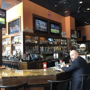 a man sitting at a bar