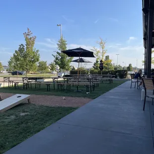 a little girl playing corn hole