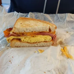 Ham, egg, and cheese on sourdough bread.