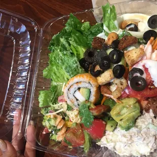 a salad in a plastic container