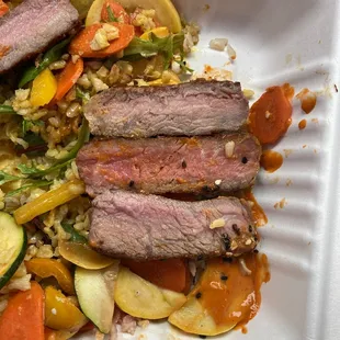 a plate of meat and vegetables