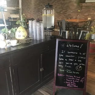 a chalkboard sign in a kitchen