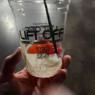 a person holding a cup of coffee