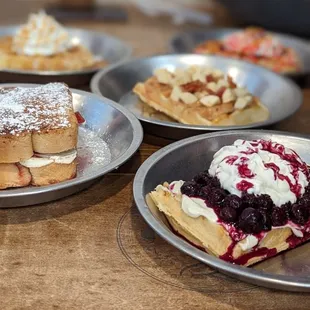 a variety of waffles on plates