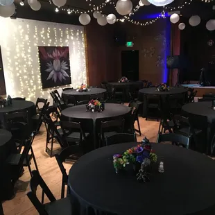 House black linens, overhead lighting and AV lighting set to make any event a party.