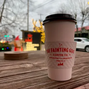 a coffee cup on a wooden table