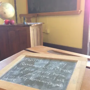 Desks with slates n chalk.