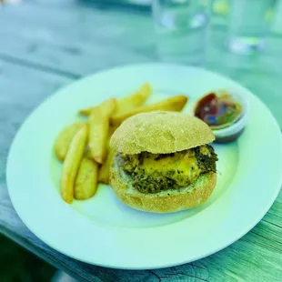 a hamburger and fries on a plate