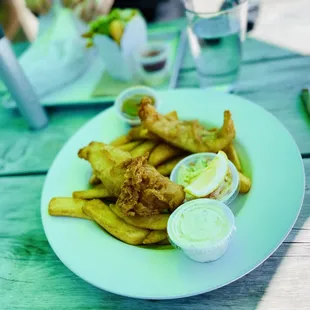 a plate of fried fish and fries