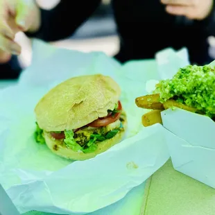 a sandwich and fries on a table