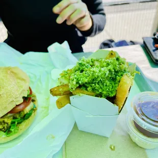 a hamburger and fries on a tray