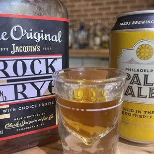 a glass of beer and a can of beer