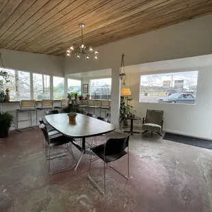 a dining room with a table and chairs