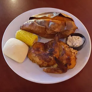Half chicken, corn, sweet potato, roll.