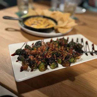 Brussel sprouts - Crispy brussels, bacon, red onion, balsamic glaze.