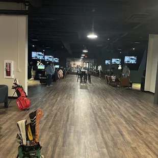 View from bar area  Walls divide the bays  Bring your clubs  Wear your golf shoes  Private room is behind me here