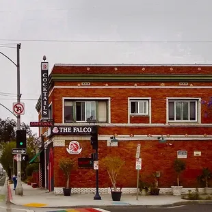 a red brick building with a sign that says the falcon