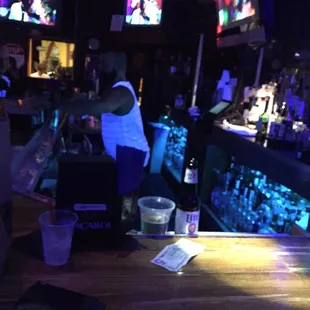 Bartender doing a poor job of servicing the bar.