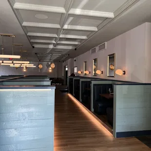 an empty restaurant with a long counter