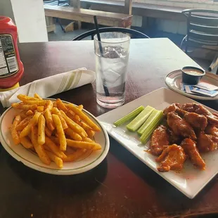 Side of fries and 10piece wings tossed in lemon pepper and mango habanero sauce.