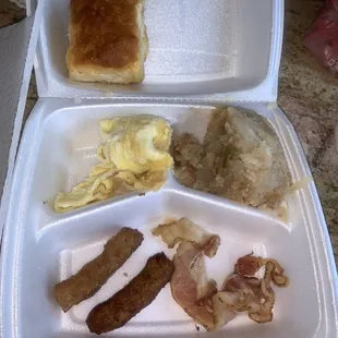 Breakfast with undercooked pork sausage and the raw bacon, the chicken was in the cooking until it's cooked all the way