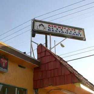 The sign at the top of the restaurant