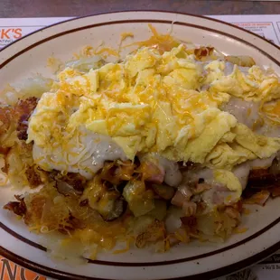 Jake's Homefries. Sausage gravy mixins: ham, cheese, sausage link pieces on a mound of perfect homefries. Scrambled eggs.
