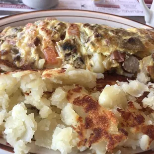 Omelet with potatoes. Liked it had lots of cheese, not bad. Maybe a bit too many fillings to egg ratio.