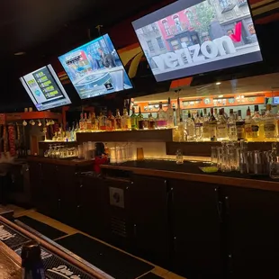 a bar with multiple screens